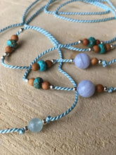 Load image into Gallery viewer, Throat Chakra Activating Silk Thread